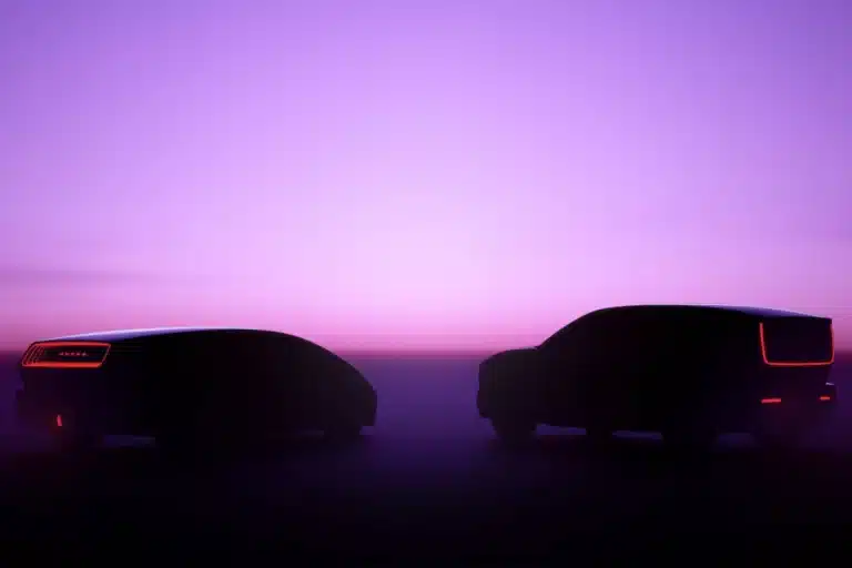 Two silhouetted futuristic vehicles with distinct tail lights against a purple sunset sky.